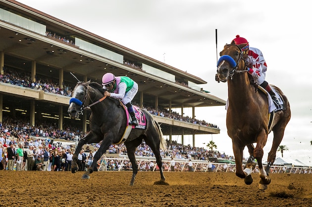 DEL MAR, CA - AUGUST 19: Collected #2, ridden by Martin Garcia holds off the late charge of Arrogate #8, ridden by Mike Smith to win theTVG Pacific Classic at Del Mar Thoroughbred Club, on August 19, 2017 in Del Mar, California. (Photo by Alex Evers/Eclipse Sportswire/Getty Images)