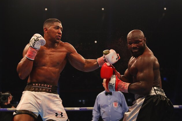 CARDIFF, WALES - OCTOBER 28:  Anthony Joshua (white trunks) and Carlos Takam (black trunks) in action during their IBF, WBA & IBO Heavyweight Championship contest at Principality Stadium on October 28, 2017 in Cardiff, Wales.  (Photo by Richard Heathcote/Getty Images)