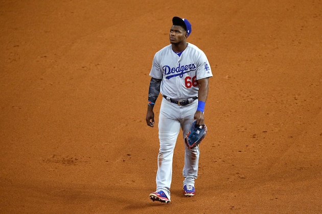 HOUSTON, TX - OCTOBER 30: Yasiel Puig #66 of the Los Angeles Dodgers walks off the field after being defeated by the Houston Astros in 10 innings during game five of the 2017 World Series at Minute Maid Park on October 30, 2017 in Houston, Texas.  The Astros defeated the Dodgers 13-12. (Photo by Bob Levey/Getty Images)