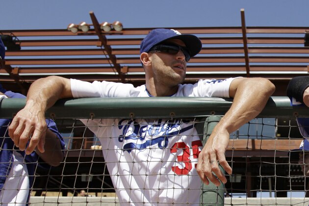 FILE - In this March 24, 2011, file photo, Los Angeles Dodgers' Gabe Kapler stands in the dugout before the Dodgers' spring training baseball game against the Colorado Rockies in Glendale, Ariz. Kapler will be hired to manage the Philadelphia Phillies, according to a person familiar with the decision. The person spoke to The Associated Press on condition of anonymity because an official announcement hasn't been made. (AP Photo/Nam Y. Huh, File)