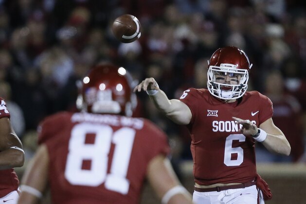 Oklahoma quarterback Baker Mayfield (6) passes to tight end Mark Andrews (81) in the first quarter of an NCAA college football game in Norman, Okla., Saturday, Oct. 28, 2017. (AP Photo/Sue Ogrocki)