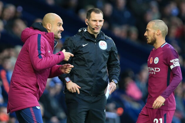 Manchester City's Spanish manager Pep Guardiola (L) gestures to Manchester City's Spanish midfielder David Silva (R) during the English Premier League football match between West Bromwich Albion and Manchester City at The Hawthorns stadium in West Bromwich, central England, on October 28, 2017.
 / AFP PHOTO / Lindsey PARNABY / RESTRICTED TO EDITORIAL USE. No use with unauthorized audio, video, data, fixture lists, club/league logos or 'live' services. Online in-match use limited to 75 images, no video emulation. No use in betting, games or single club/league/player publications.  /         (Photo credit should read LINDSEY PARNABY/AFP/Getty Images)