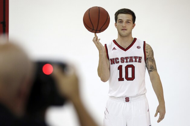 FILE - In this Sept. 26, 2017, file photo, North Carolina State's Braxton Beverly poses for a photograph during the school's NCAA college basketball media day in Raleigh, N.C. The NCAA has denied an appeal from the school seeking for the freshman to be eligible to play this year after taking summer classes at Ohio State before a late coaching change prompted him to get his release and come to N.C State. (AP Photo/Gerry Broome, File)