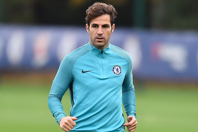 Chelsea's Spanish midfielder Cesc Fabregas runs with the ball during a team training session at Chelsea's Cobham training facility in Stoke D'Abernon, southwest of London, on October 17, 2017, on the eve of their UEFA Champions League Group C football match against Roma .

 / AFP PHOTO / GLYN KIRK        (Photo credit should read GLYN KIRK/AFP/Getty Images)