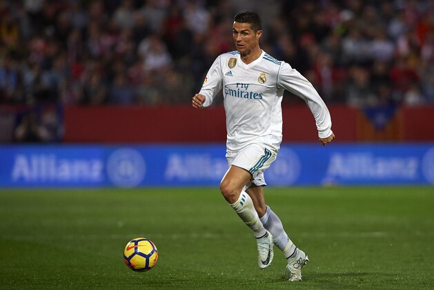 GIRONA, SPAIN - OCTOBER 29:  Cristiano Ronaldo of Real Madrid runs with the ball during the La Liga match between Girona and Real Madrid at Municipal de Montilivi Stadium on October 29, 2017 in Girona, Spain.  (Photo by Manuel Queimadelos Alonso/Getty Images)