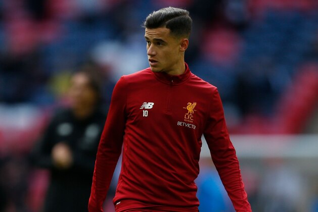 Liverpool's Brazilian midfielder Philippe Coutinho warms up for the English Premier League football match between Tottenham Hotspur and Liverpool at Wembley Stadium in London, on October 22, 2017. / AFP PHOTO / IKIMAGES / Ian KINGTON / RESTRICTED TO EDITORIAL USE. No use with unauthorized audio, video, data, fixture lists, club/league logos or 'live' services. Online in-match use limited to 45 images, no video emulation. No use in betting, games or single club/league/player publications.  /         (Photo credit should read IAN KINGTON/AFP/Getty Images)
