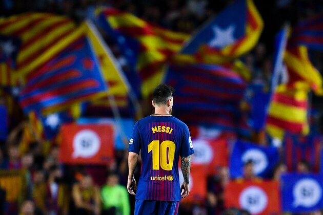 BARCELONA, SPAIN - SEPTEMBER 19: Lionel Messi of FC Barcelona looks on as Catalan Pro-Independence flags are seen on the background during the La Liga match between Barcelona and SD Eibar at Camp Nou on September 19, 2017 in Barcelona, Spain. (Photo by David Ramos/Getty Images) BARCELONA, SPAIN - SEPTEMBER 19: Lionel Messi of FC Barcelona looks on as Catalan Pro-Independence flags are seen on the background during the La Liga match between Barcelona and SD Eibar at Camp Nou on September 19, 2017 in Barcelona, Spain. (Photo by David Ramos/Getty Images)