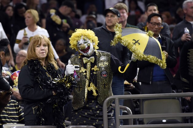 Fans wear Halloween costumes during an NFL football game between the New Orleans Saints and the Chicago Bears in New Orleans, Sunday, Oct. 29, 2017. (AP Photo/Bill Feig)