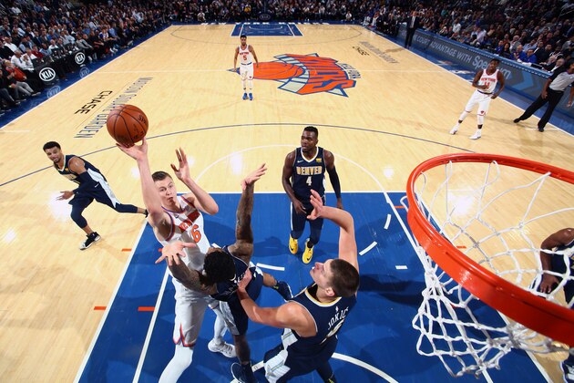 NEW YORK, NY - OCTOBER 30:  Kristaps Porzingis #6 of the New York Knicks shoots the ball against the Denver Nuggets on October 30, 2017 at Madison Square Garden in New York City, New York.  NOTE TO USER: User expressly acknowledges and agrees that, by downloading and or using this photograph, User is consenting to the terms and conditions of the Getty Images License Agreement. Mandatory Copyright Notice: Copyright 2017 NBAE  (Photo by Nathaniel S. Butler/NBAE via Getty Images)