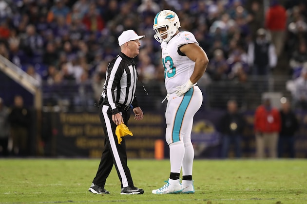 BALTIMORE, MD - OCTOBER 26: Defensive Tackle Ndamukong Suh #93 of the Miami Dolphins talks with referee John Parry after a play in the third quarter against the Baltimore Ravens at M&T Bank Stadium on October 26, 2017 in Baltimore, Maryland. (Photo by Rob Carr/Getty Images)