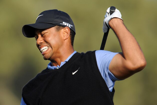 Tiger Woods winces in pain as he follows thru on his shot from the 15th tee, in the third round of the 108th U.S. Open golf tournament at Torrey Pines Golf Course in San Diego, California on June 14, 2008.  AFP PHOTO / ROBYN BECK (Photo credit should read ROBYN BECK/AFP/Getty Images)