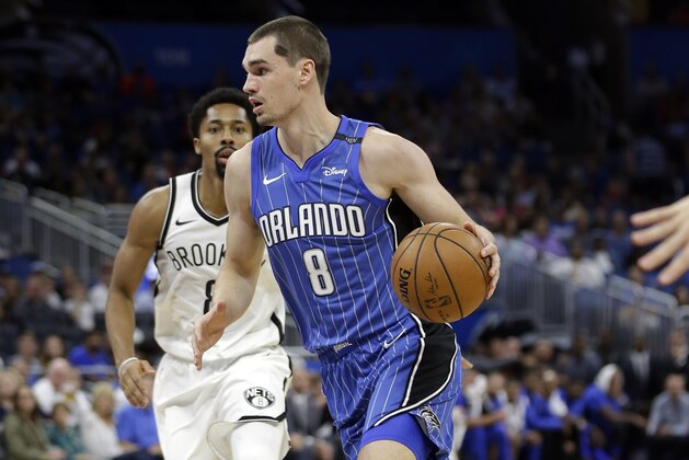 Orlando Magic's Mario Hezonja (8) drives past Brooklyn Nets' Spencer Dinwiddie during the first half of an NBA basketball game, Tuesday, Oct. 24, 2017, in Orlando, Fla. (AP Photo/John Raoux)
