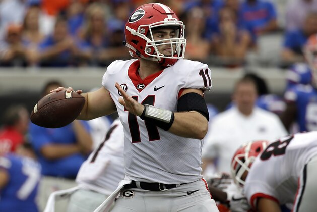 Georgia quarterback Jake Fromm throws a pass against Florida in the first half of an NCAA college football game, Saturday, Oct. 28, 2017, in Jacksonville, Fla. (AP Photo/John Raoux)