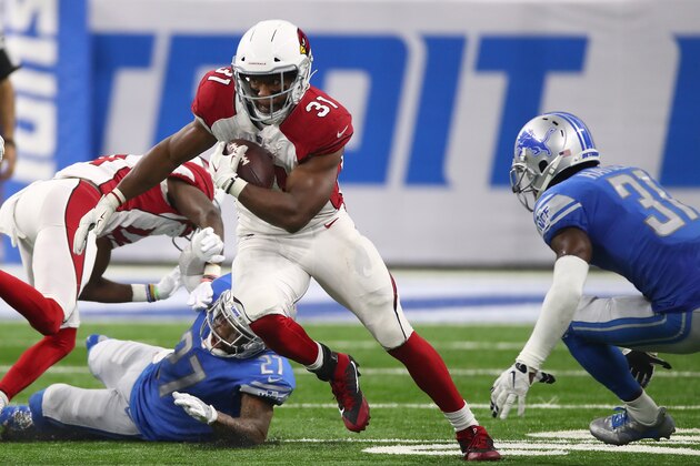 DETROIT, MI - SEPTEMBER 10: David Johnson #31 of the Arizona Cardinals escapes the tackle of Glover Quin #27 of the Detroit Lions during a second half run at Ford Field on September 10, 2017 in Detroit, Michigan. (Photo by Gregory Shamus/Getty Images)