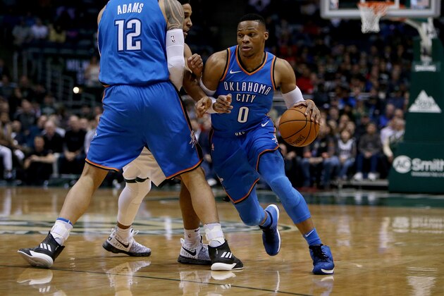 MILWAUKEE, WI - OCTOBER 31:  Russell Westbrook #0 of the Oklahoma City Thunder dribbles the ball as Steven Adams #12 sets a screen in the first quarter against the Milwaukee Bucks at Bradley Center on October 31, 2017 in Milwaukee, Wisconsin. NOTE TO USER: User expressly acknowledges and agrees that, by downloading and or using this photograph, User is consenting to the terms and conditions of the Getty Images License Agreement. (Photo by Dylan Buell/Getty Images)