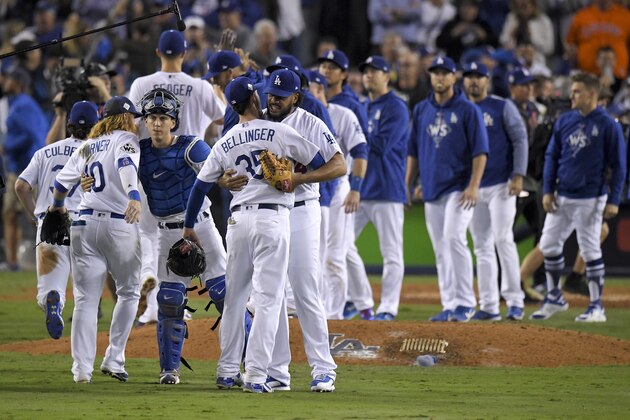 The Los Angeles Dodgers celebrate after their win against the Houston Astros in Game 6 of baseball's World Series Tuesday, Oct. 31, 2017, in Los Angeles. The Dodgers won 3-1 to tie the series at 3-3.(AP Photo/Mark J. Terrill)