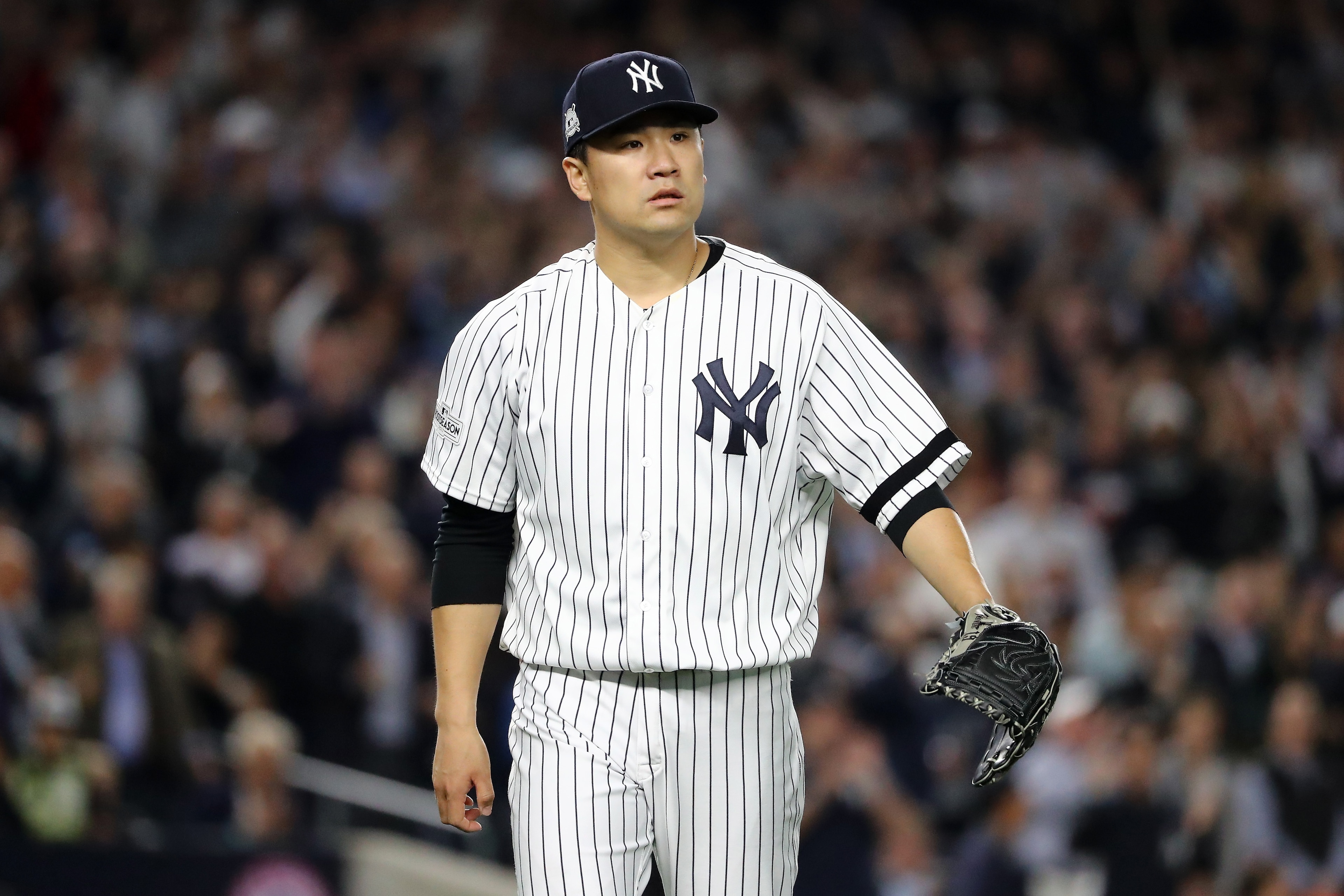 NEW YORK, NY - OCTOBER 18: Masahiro Tanaka #19 of the New York Yankees looks on during the seventh inning against the Houston Astros in Game Five of the American League Championship Series at Yankee Stadium on October 18, 2017 in the Bronx borough of New York City. (Photo by Elsa/Getty Images) NEW YORK, NY - OCTOBER 18: Masahiro Tanaka #19 of the New York Yankees looks on during the seventh inning against the Houston Astros in Game Five of the American League Championship Series at Yankee Stadium on October 18, 2017 in the Bronx borough of New York City. (Photo by Elsa/Getty Images)