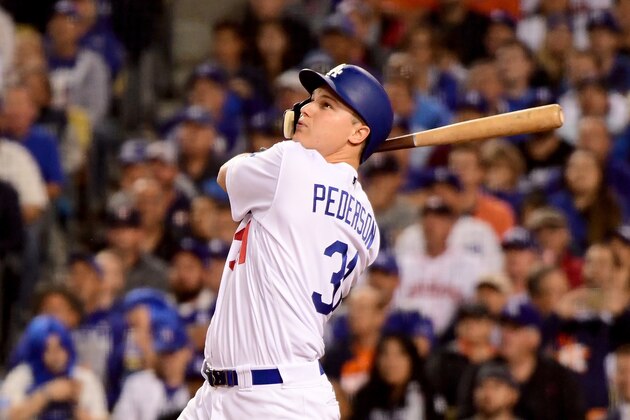 LOS ANGELES, CA - OCTOBER 31:  Joc Pederson #31 of the Los Angeles Dodgers hits a solo home run during the seventh inning against the Houston Astros in game six of the 2017 World Series at Dodger Stadium on October 31, 2017 in Los Angeles, California.  (Photo by Harry How/Getty Images)