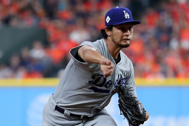 HOUSTON, TX - OCTOBER 27: Yu Darvish #21 of the Los Angeles Dodgers throws a pitch during the second inning against the Houston Astros in game three of the 2017 World Series at Minute Maid Park on October 27, 2017 in Houston, Texas.  (Photo by Tom Pennington/Getty Images)