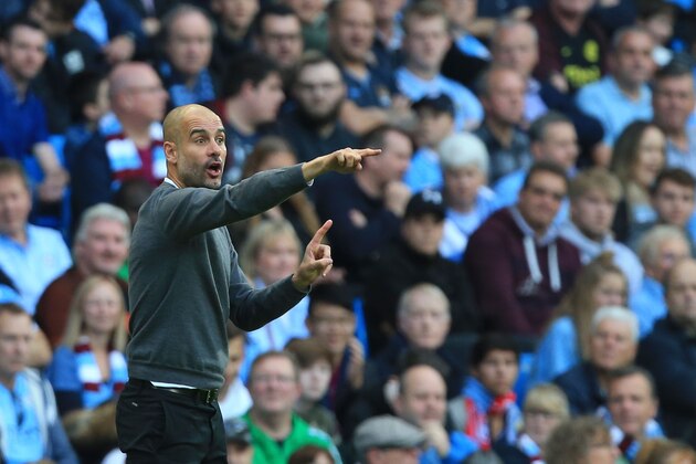 Manchester City's Spanish manager Pep Guardiola gestures from the touchline during the English Premier League football match between Manchester City and Stoke City at the Etihad Stadium in Manchester, north west England, on October 14, 2017. / AFP PHOTO / Lindsey PARNABY / RESTRICTED TO EDITORIAL USE. No use with unauthorized audio, video, data, fixture lists, club/league logos or 'live' services. Online in-match use limited to 75 images, no video emulation. No use in betting, games or single club/league/player publications.  /         (Photo credit should read LINDSEY PARNABY/AFP/Getty Images)