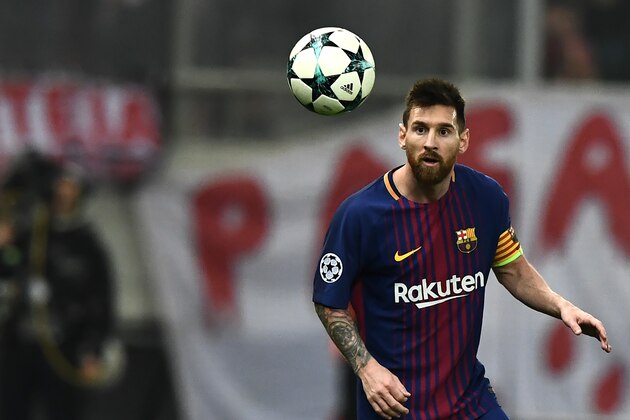 Barcelona's Argentinian forward Lionel Messi eyes the ball during the UEFA Champions League group D football match between FC Barcelona and Olympiakos FC at the Karaiskakis stadium in Piraeus near Athens on October 31, 2017.  / AFP PHOTO / ARIS MESSINIS        (Photo credit should read ARIS MESSINIS/AFP/Getty Images)