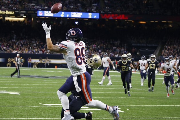 Chicago Bears tight end Zach Miller (86) pulls in a touchdown reception, that was ruled incomplete upon review, as New Orleans Saints defensive back Rafael Bush (25) covers, in the second half of an NFL football game in New Orleans, Sunday, Oct. 29, 2017. Miller injured his leg on the play and was carted off the field. (AP Photo/Butch Dill) Chicago Bears tight end Zach Miller (86) pulls in a touchdown reception, that was ruled incomplete upon review, as New Orleans Saints defensive back Rafael Bush (25) covers, in the second half of an NFL football game in New Orleans, Sunday, Oct. 29, 2017. Miller injured his leg on the play and was carted off the field. (AP Photo/Butch Dill)