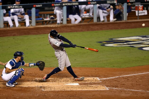 LOS ANGELES, CA - OCTOBER 31:  George Springer #4 of the Houston Astros hits a solo home run during the third inning against the Los Angeles Dodgers in game six of the 2017 World Series at Dodger Stadium on October 31, 2017 in Los Angeles, California.  (Photo by Christian Petersen/Getty Images)