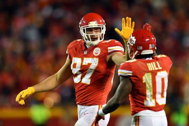 KANSAS CITY, MO - OCTOBER 30:  Tight end Travis Kelce #87 of the Kansas City Chiefs high-fives wide receiver Tyreek Hill #10 during the game against the Denver Broncos at Arrowhead Stadium on October 30, 2017 in Kansas City, Missouri.  (Photo by Peter Aiken/Getty Images)