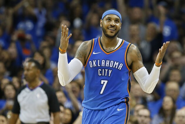Oklahoma City Thunder forward Carmelo Anthony (7) gestures after hitting a three-point basket in the second quarter of an NBA basketball game against the New York Knicks in Oklahoma City, Thursday, Oct. 19, 2017. (AP Photo/Sue Ogrocki)
