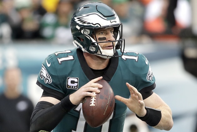 Philadelphia Eagles' Carson Wentz looks to pass during the first half of an NFL football game against the San Francisco 49ers, Sunday, Oct. 29, 2017, in Philadelphia,. (AP Photo/Michael Perez)