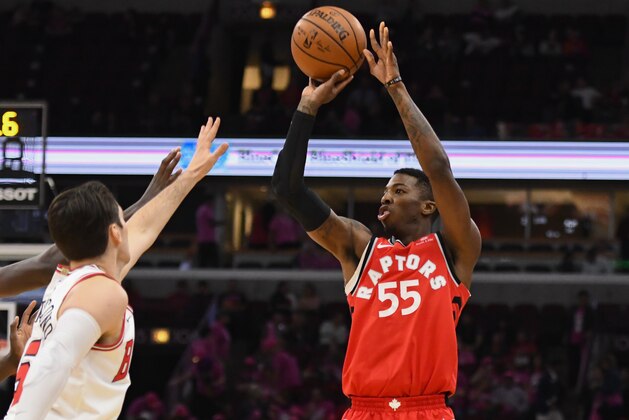 Toronto Raptors guard Delon Wright (55) shoots past Chicago Bulls forward Bobby Portis, left, and guard Ryan Arcidiacono, center, during the first half of an NBA preseason basketball game Friday, Oct. 13, 2017, in Chicago. (AP Photo/Matt Marton)