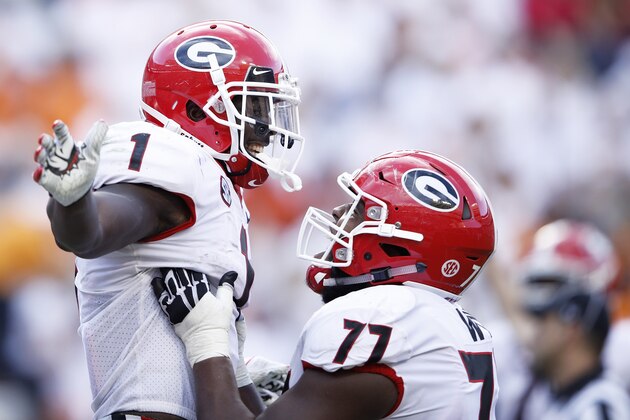 KNOXVILLE, TN - SEPTEMBER 30: Sony Michel #1 of the Georgia Bulldogs is lifted up by Isaiah Wynn #77 after scoring a touchdown during a game against the Tennessee Volunteers at Neyland Stadium on September 30, 2017 in Knoxville, Tennessee. Georgia won 41-0. (Photo by Joe Robbins/Getty Images) KNOXVILLE, TN - SEPTEMBER 30: Sony Michel #1 of the Georgia Bulldogs is lifted up by Isaiah Wynn #77 after scoring a touchdown during a game against the Tennessee Volunteers at Neyland Stadium on September 30, 2017 in Knoxville, Tennessee. Georgia won 41-0. (Photo by Joe Robbins/Getty Images)