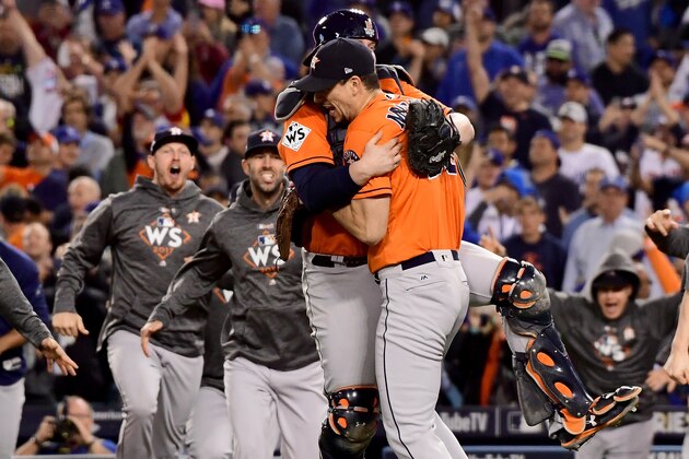 LOS ANGELES, CA - NOVEMBER 01:  Brian McCann #16 and Charlie Morton #50 of the Houston Astros celebrate with teammates after defeating the Los Angeles Dodgers in game seven with a score of 5 to 1 to win the 2017 World Series at Dodger Stadium on November 1, 2017 in Los Angeles, California.  (Photo by Harry How/Getty Images)