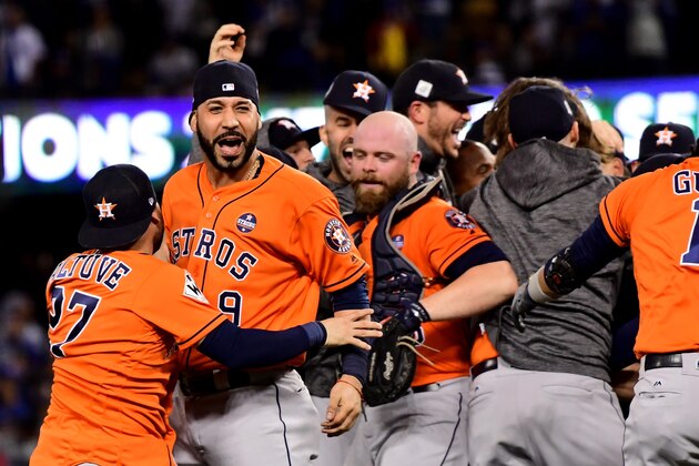 LOS ANGELES, CA - NOVEMBER 01:  Marwin Gonzalez #9 of the Houston Astros celebrates with teammates after defeating the Los Angeles Dodgers 5-1 in game seven to win the 2017 World Series at Dodger Stadium on November 1, 2017 in Los Angeles, California.  (Photo by Harry How/Getty Images)