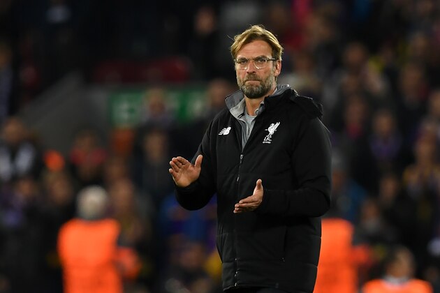 Liverpool's German manager Jurgen Klopp applauds supporters on the pitch after the UEFA Champions League Group E football match between Liverpool and NK Maribor at Anfield in Liverpool, north-west England on November 1, 2017.
Liverpool won the game 3-0. / AFP PHOTO / Paul ELLIS        (Photo credit should read PAUL ELLIS/AFP/Getty Images)