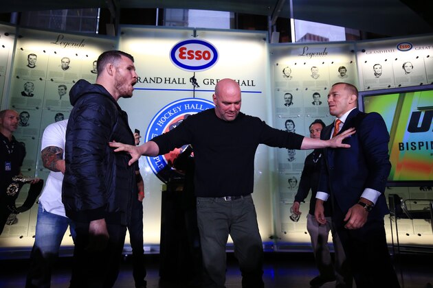 TORONTO, ON - OCTOBER 13:  Michael Bisping and Georges St-Pierre face off following the UFC 217 press conference with Dana White at the Hockey Hall of Fame on October 13, 2017 in Toronto, Canada.  (Photo by Vaughn Ridley/Zuffa LLC/Zuffa LLC via Getty Images)