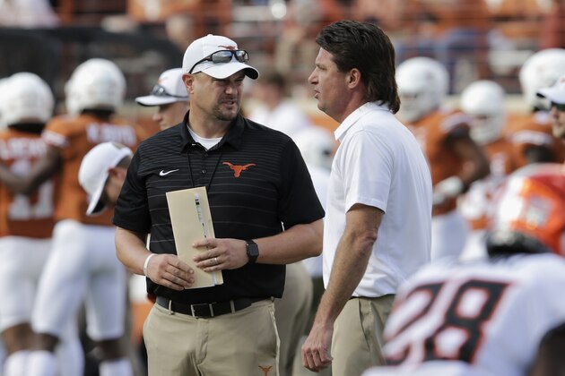 AUSTIN, TX - OCTOBER 21:  Head coach Tom Herman of the Texas Longhorns talks with head coach Mike Gundy of the Oklahoma State Cowboys  before the game at Darrell K Royal-Texas Memorial Stadium on October 21, 2017 in Austin, Texas.  (Photo by Tim Warner/Getty Images)