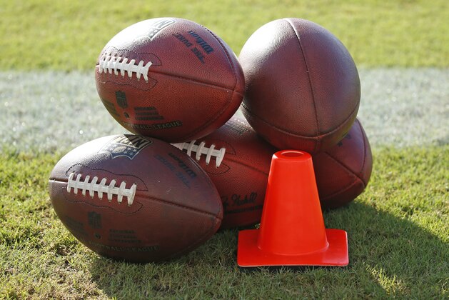 DAVIE, FL - AUGUST 10: Footballs on the turf of the Miami Dolphins field during the teams training camp on August 10, 2016 at the Miami Dolphins training facility in Davie, Florida. (Photo by Joel Auerbach/Getty Images)