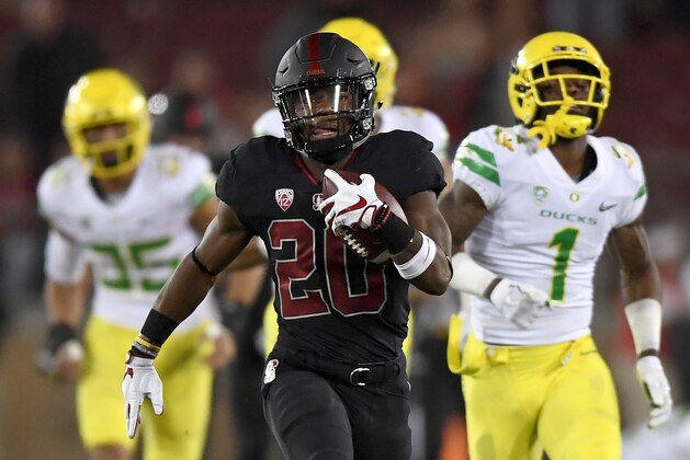 PALO ALTO, CA - OCTOBER 14:  Bryce Love #20 of the Stanford Cardinal scores on a sixty seven yard touchdown run against the Oregon Ducks during the first quarter of the NCAA football game at Stanford Stadium on October 14, 2017 in Palo Alto, California.  (Photo by Thearon W. Henderson/Getty Images)