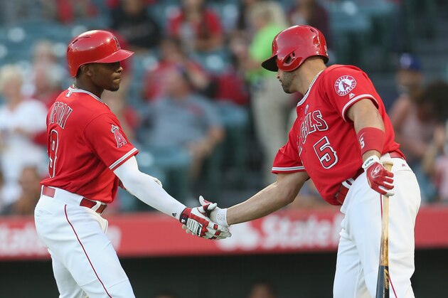 ANAHEIM, CA - SEPTEMBER 16:   Justin Upton 9 of the Los Angeles Angels of Anaheim is greeted by on deck batter Albert Pujols #5 as he returns to the  dugout after hitting a solo home run in the first inning against the Texas Rangers on September 16, 2017 at Angel Stadium of Anaheim in Anaheim, California.  (Photo by Stephen Dunn/Getty Images)