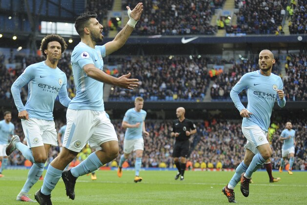 Manchester City's Sergio Aguero, centre, celebrates after scoring during the English Premier League soccer match between Manchester City and Burnley at Etihad stadium, Manchester, England, Saturday, Oct. 21, 2017. (AP Photo/Rui Vieira)