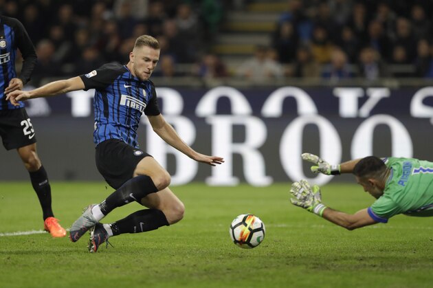 Inter Milan's Milan Skriniar scores first goal for his side during an Italian Serie A soccer match between Inter Milan and Sampdoria, at the San Siro stadium in Milan, Italy, Tuesday, Oct. 24, 2017. (AP Photo/Luca Bruno)
