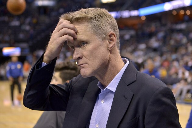 FILE - In this Oct. 21, 2017, file photo, Golden State Warriors head coach Steve Kerr walks onto the court before an NBA basketball game against the Memphis Grizzlies, in Memphis, Tenn. There's still no reason to think that a fourth consecutive NBA Finals matchup between Golden State and Cleveland cannot happen, even though both teams have been often less than razor-sharp to start this season. Warriors coach Kerr, frankly, isn't surprised by some early struggles. (AP Photo/Brandon Dill, File)