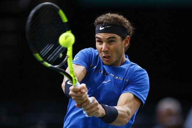 Rafael Nadal of Spain returns the ball to Pablo Cuevas of Uruguay during the third round of the Paris Masters tennis tournament at the Bercy Arena in Paris, France, Thursday, Nov. 2, 2017. (AP Photo/Francois Mori)