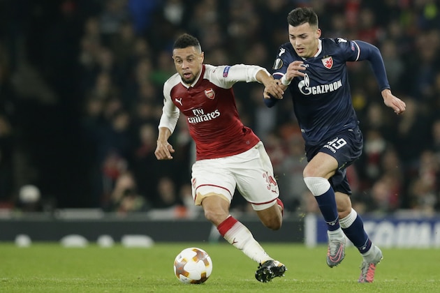 Arsenal's Francis Coquelin, left, and Red Star's Nemanja Radonjic challenge for the ball during a Group H Europa League soccer match between Arsenal London and Red Star Belgrade at the Emirates stadium in London, Britain, Thursday, Nov. 2, 2017. (AP Photo/Tim Ireland)