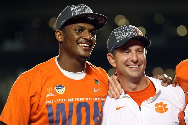 MIAMI GARDENS, FL - DECEMBER 31:  Deshaun Watson #4 of the Clemson Tigers stands with head coach Dabo Swinney after the Clemson Tigers defeated the Oklahoma Sooners with a score of 37 to 17 to win the 2015 Capital One Orange Bowl at Sun Life Stadium on December 31, 2015 in Miami Gardens, Florida.  (Photo by Streeter Lecka/Getty Images)