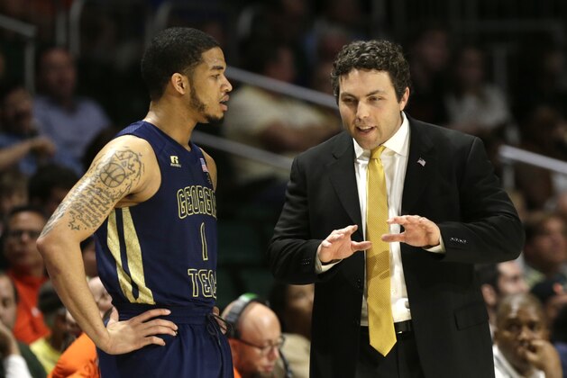 Georgia Tech head coach Josh Pastner, right, talks with guard Tadric Jackson (1) during the first half of an NCAA college basketball game against Miami, Wednesday, Feb. 15, 2017, in Coral Gables, Fla. (AP Photo/Lynne Sladky)