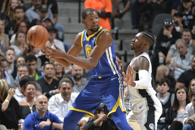 SAN ANTONIO, TX - NOVEMBER 2:  Kevin Durant #35 of the Golden State Warriors handles the ball against Brandon Paul #3 of the San Antonio Spurs on November 2, 2017 at the AT&T Center in San Antonio, Texas. NOTE TO USER: User expressly acknowledges and agrees that, by downloading and or using this photograph, user is consenting to the terms and conditions of the Getty Images License Agreement. Mandatory Copyright Notice: Copyright 2017 NBAE (Photos by Mark Sobhani/NBAE via Getty Images)