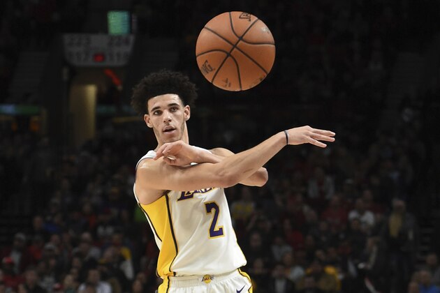 Los Angeles Lakers guard Lonzo Ball passes the ball during the first quarter of the team's NBA basketball game against the Portland Trail Blazers in Portland, Ore., Thursday, Nov. 2, 2017. (AP Photo/Steve Dykes)