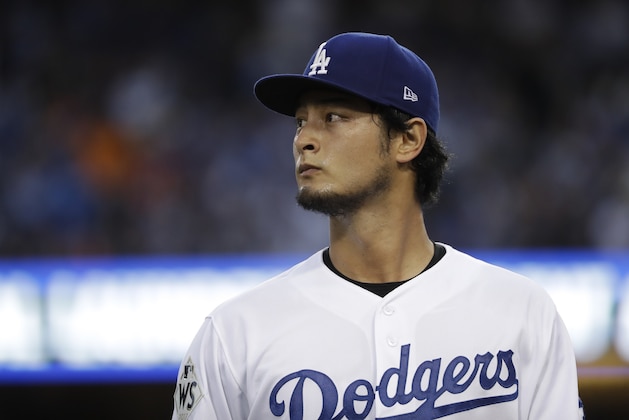 Los Angeles Dodgers starting pitcher Yu Darvish walks to the dugout during the first inning of Game 7 of baseball's World Series against the Houston Astros Wednesday, Nov. 1, 2017, in Los Angeles. (AP Photo/Matt Slocum)